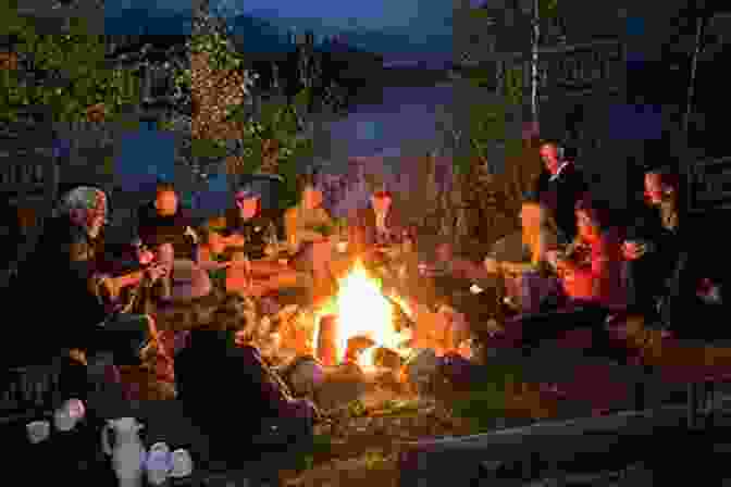 Group Of People Enjoying A Meal Around A Campfire The Big Of Camp Cooking